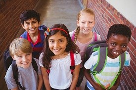 Primary school kids with school bags