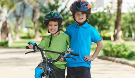 2 boys with bike helmets